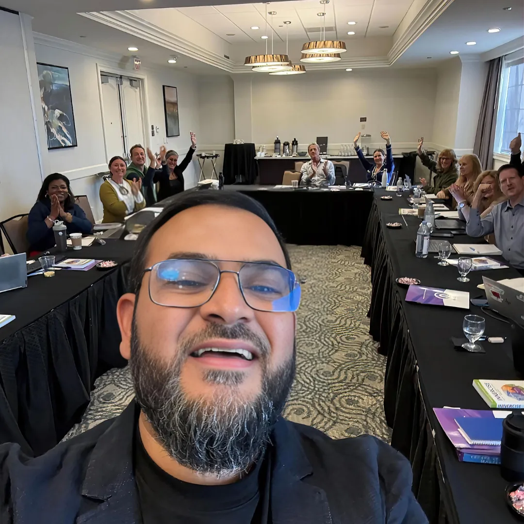 Muhammad Asmal with attendees at a mastermind in San Diego
